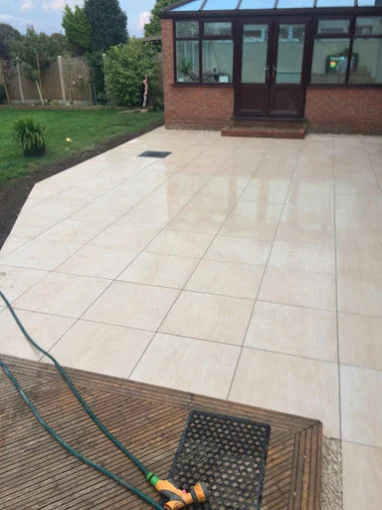 Large porcelain patio by conservatory